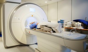 Female Patient Going Through MRI Scan In Hospital